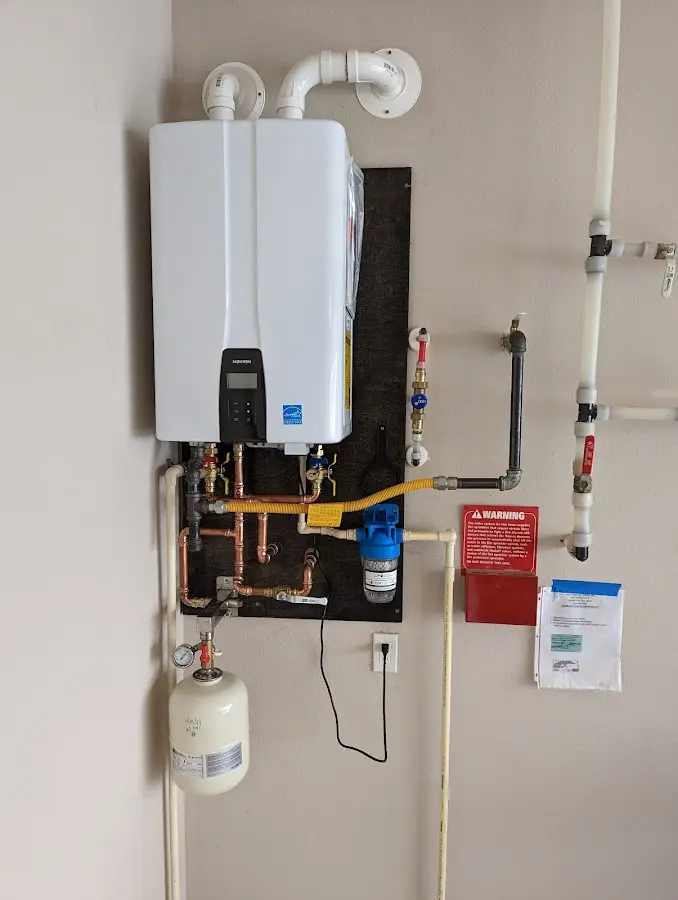 Professional plumber installing copper piping in a Jackson home